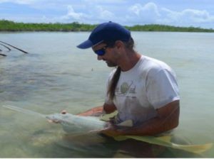 Man-holding-fish-FSU-Marine-Lab-Lecture-hMN4H0.tmp_ Man-holding-fish-FSU-Marine-Lab-Lecture-hMN4H0.tmp_