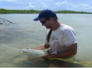 Man-holding-fish-FSU-Marine-Lab-Lecture-hMN4H0.tmp_