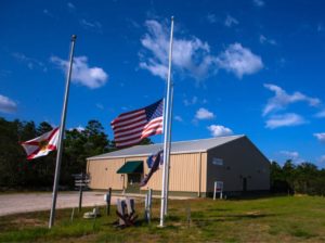 Camp-Gordon-Johnston-WWII-Museum-in-Carrabelle-FL-with-flags-at-half-staff-in-honor-of-911.-PyIuXO.tmp_