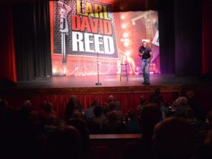 Comedian-Earl-David-Reed-performing-his-comedy-act-at-the-Dixie-Theatre-in-Apalachicola-Florida.-zVFDQv.tmp_ Comedian-Earl-David-Reed-performing-his-comedy-act-at-the-Dixie-Theatre-in-Apalachicola-Florida.-zVFDQv.tmp_